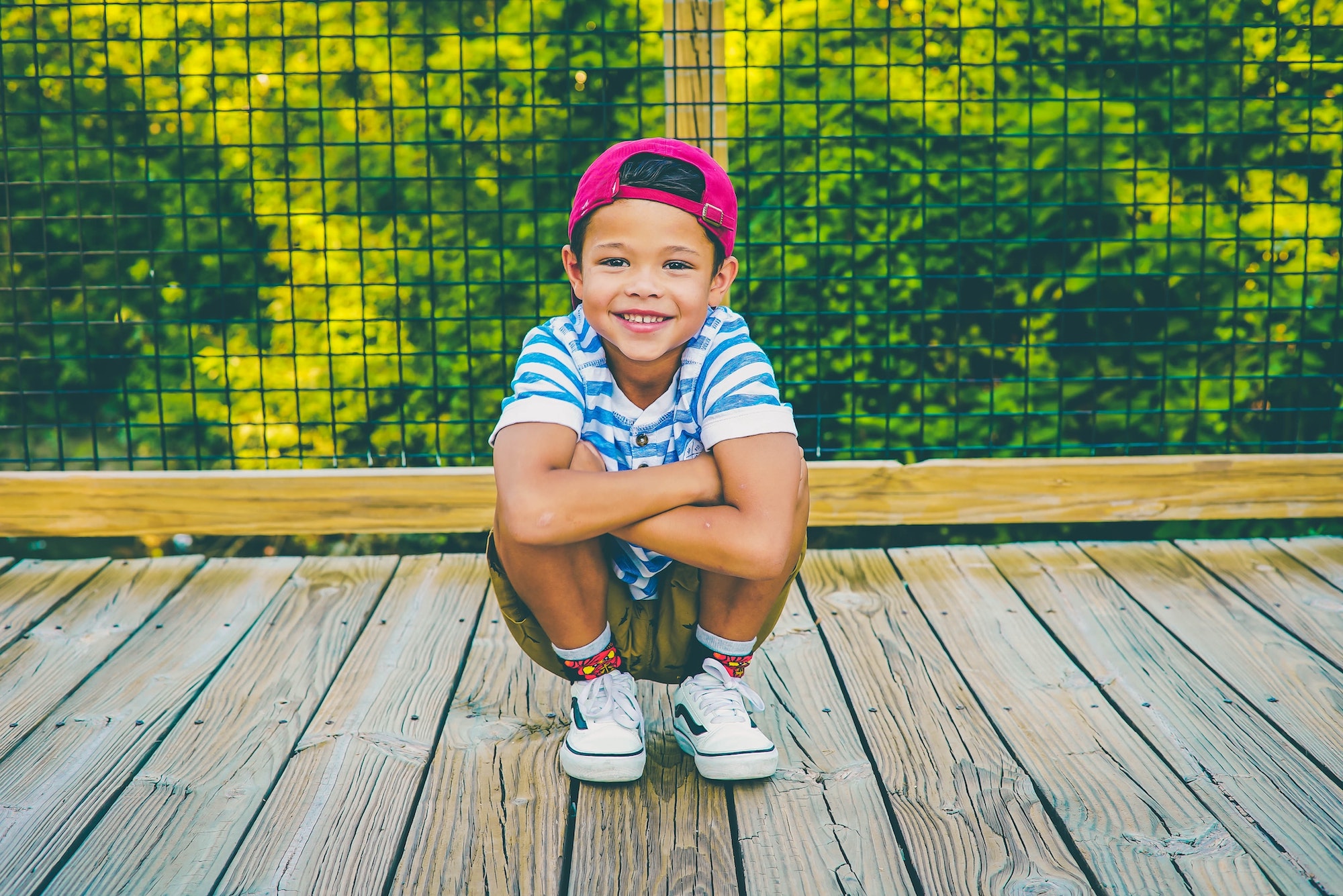 young child smiling with teeth visible